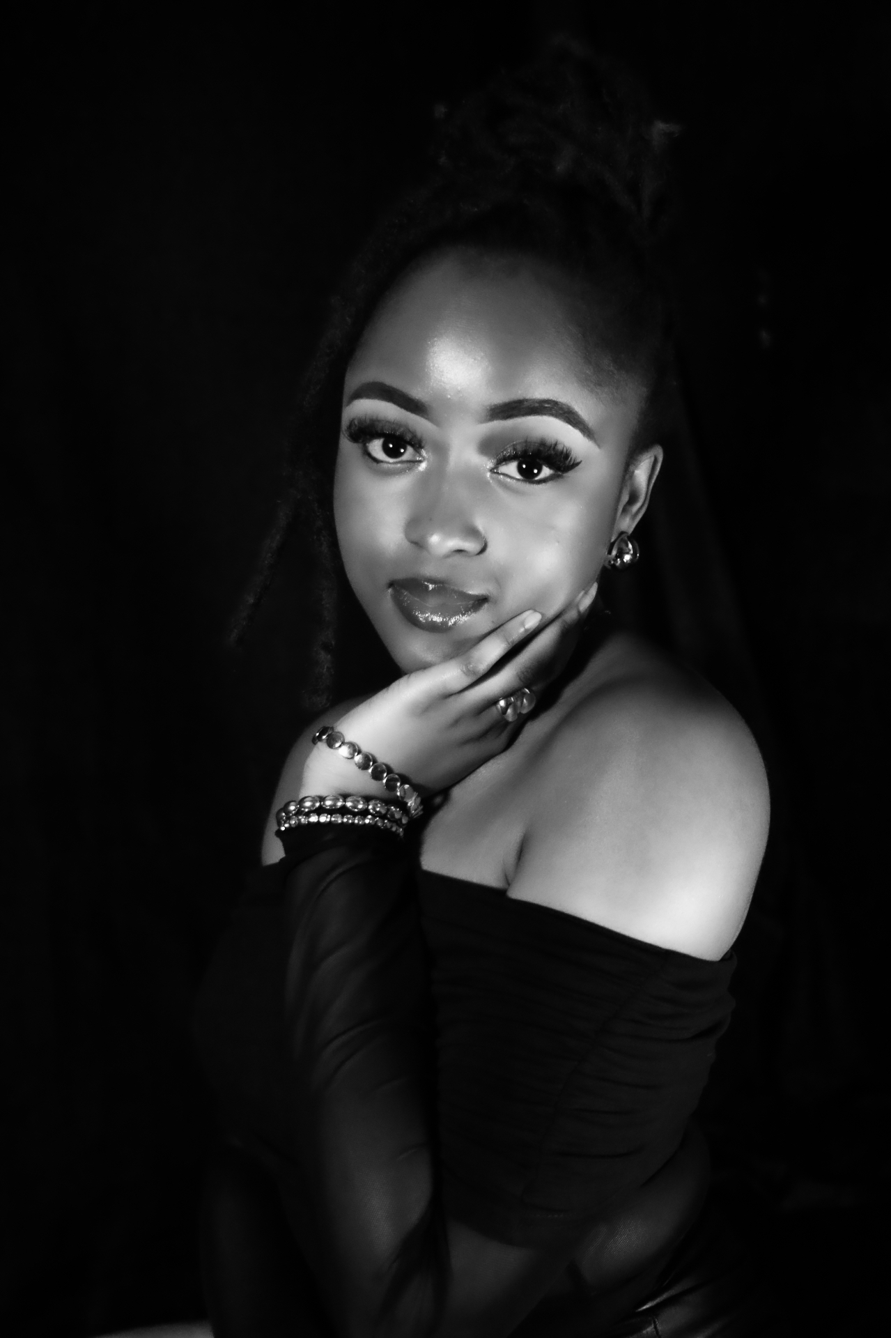 Low-key studio beauty portrait with soft rim light