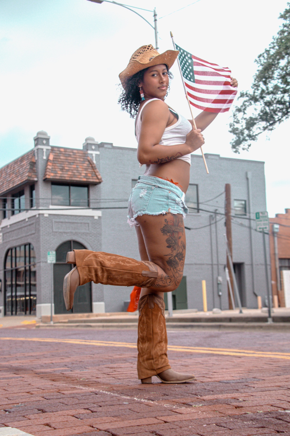Outdoor downtown portrait with hat and boots