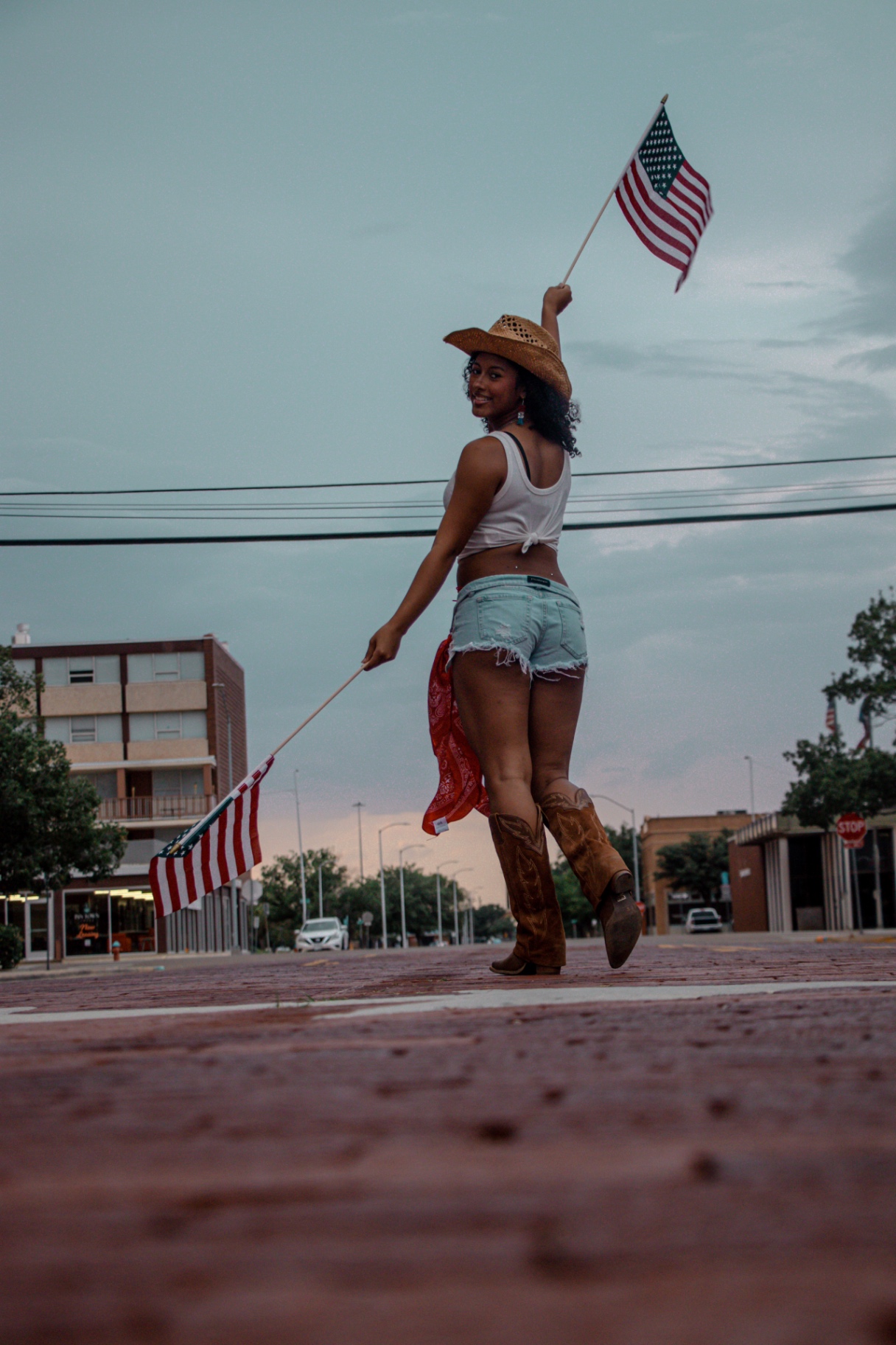 Styled western concept shoot on a brick street at dusk